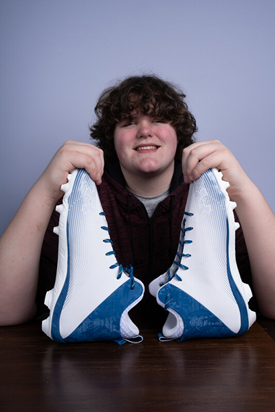 Eric holding shoes