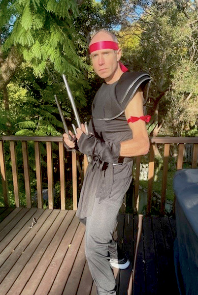 fastest marathon dressed as a ninja looking at camera