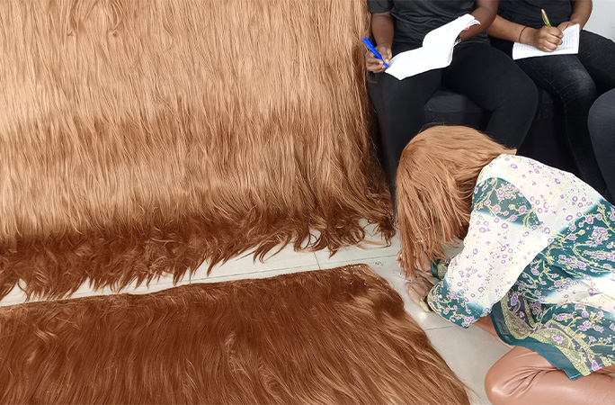 Helen working on the widest wig