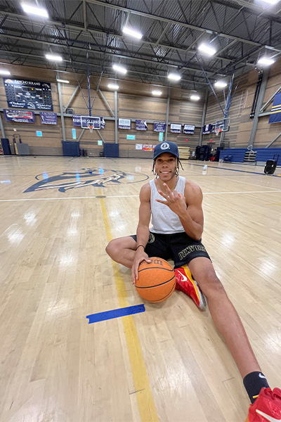 Jeremy sitting on the court