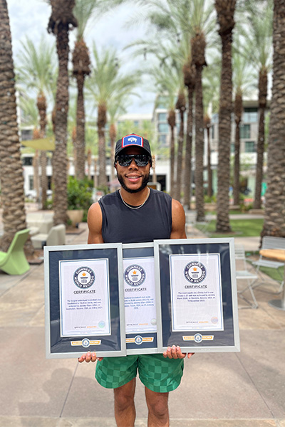 Jeremy with his three certificates