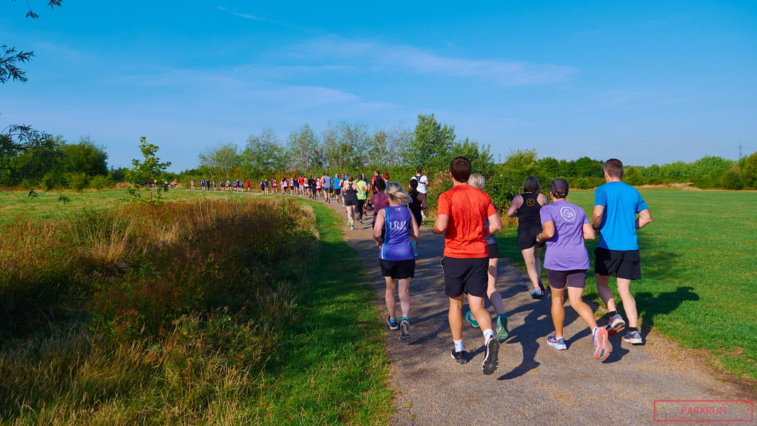 People running through a field