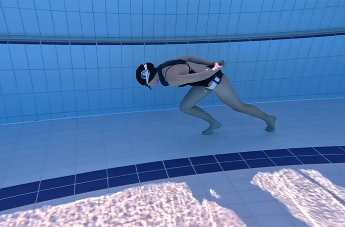 Amber walking underwater