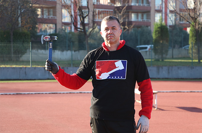Osman holding an axe