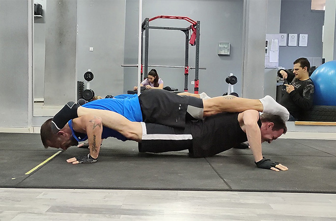 George and Apostolos doing tandem push ups