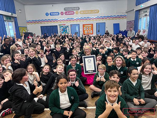 Laura in the great hall with children