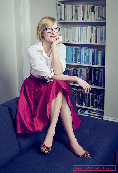 Laura Mucha with red skirt smiling