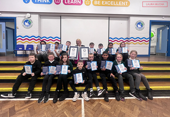 Laura with the class and smiling