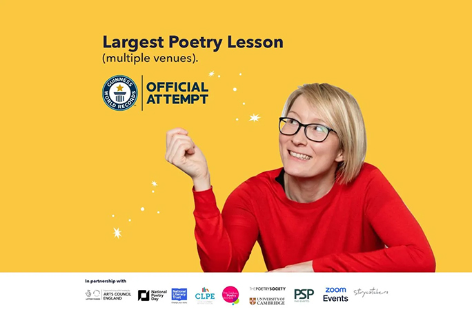 Laura smiling with children and certificate