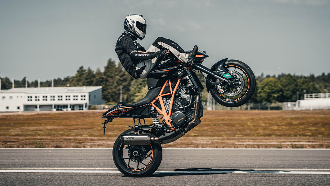 Magnus performing a handlebar wheelie on his motorbike