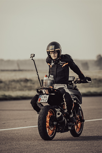 Magnus riding his bike backwards