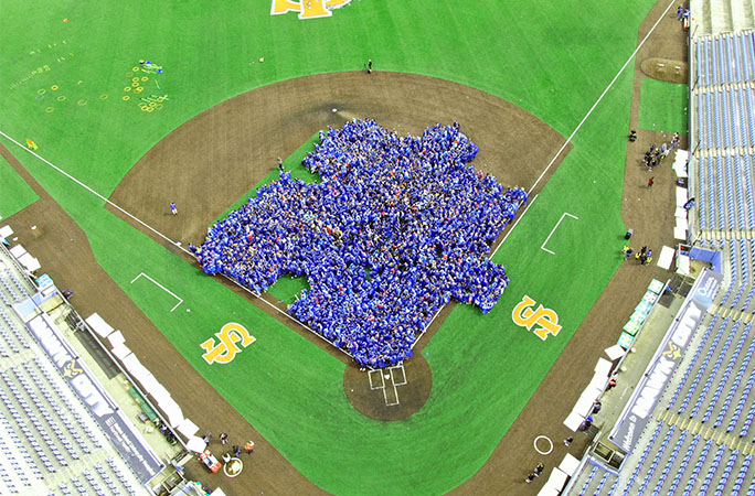 People forming the image of a puzzle piece