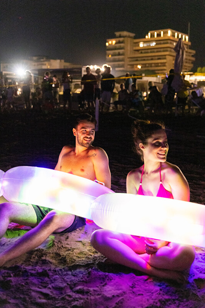 People smiling with LED lights