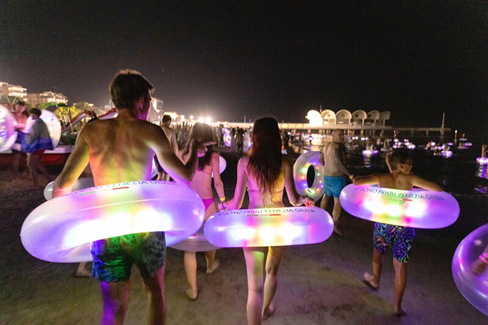 People walking with LED lights