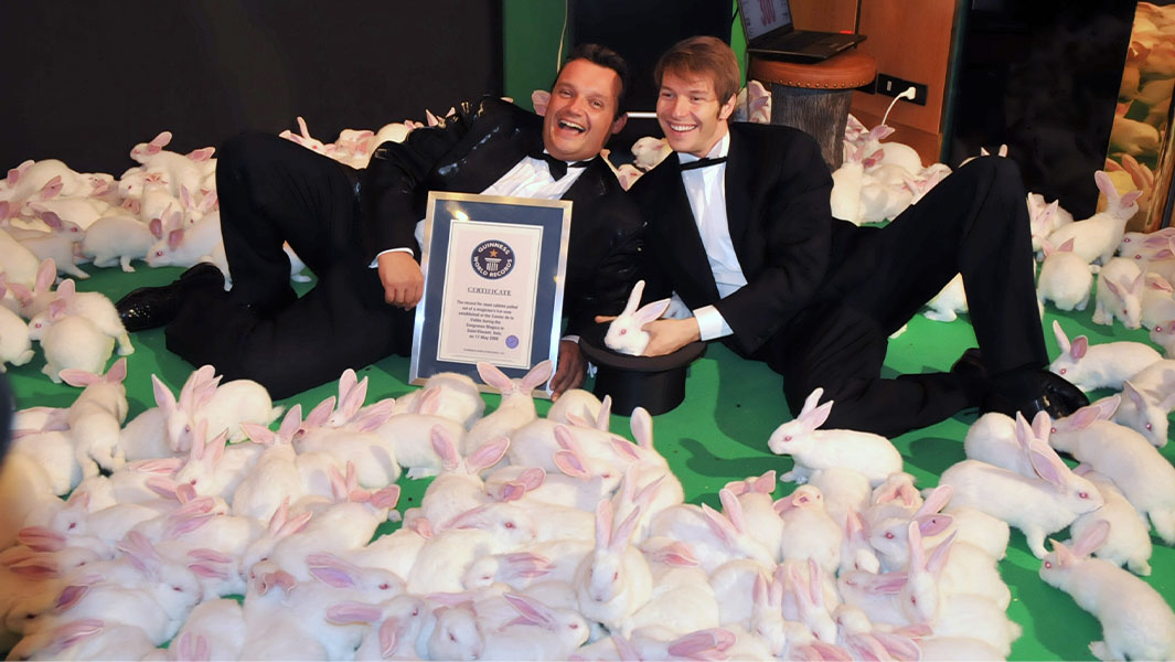 Magician Walter Rolfo with his partner Piero Ustignani celebrate with their Guinness World Record and the 300 rabbits they pulled from a hat