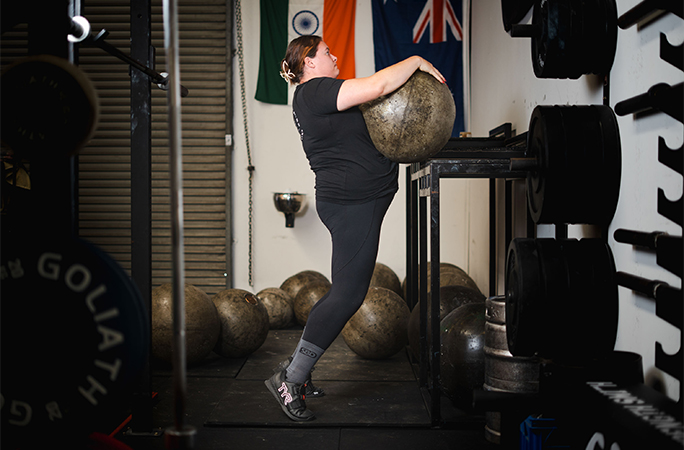 Nicole lifting the stone