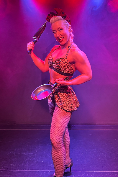 Daniella posing with frying pans