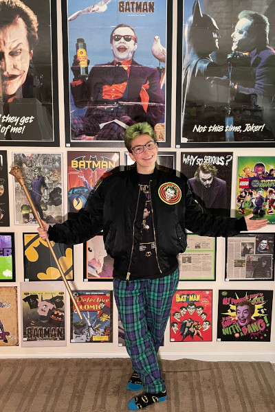 Megan posing in front of her posters