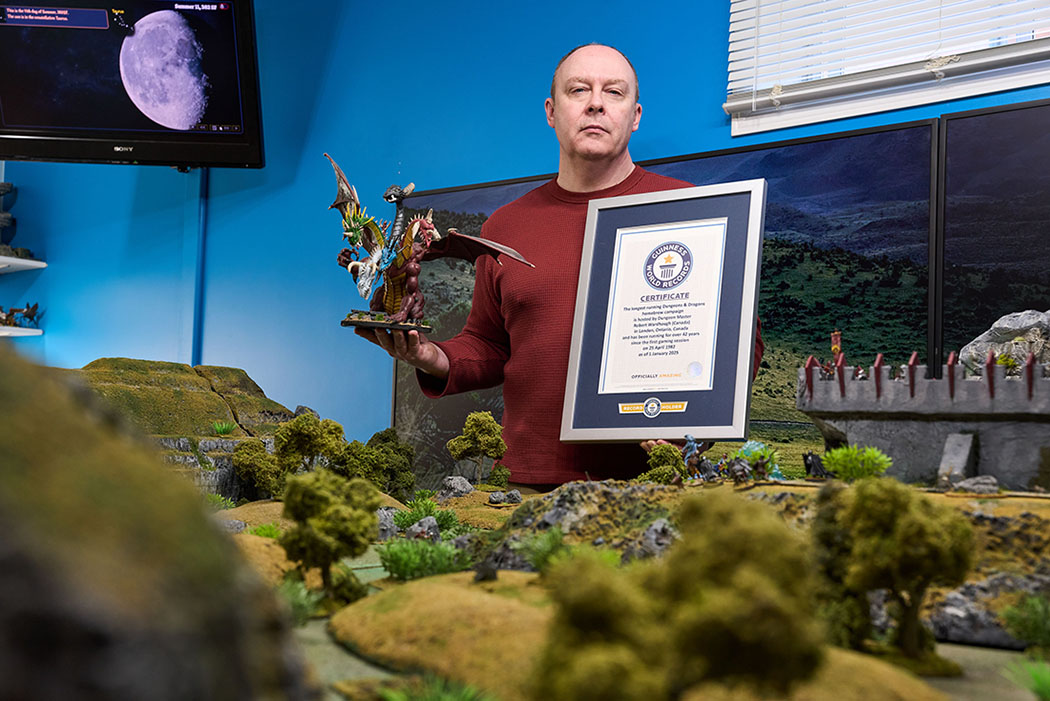 Canadian dungeon master Robert Wardaugh posing with his Guinness World Records certificate
