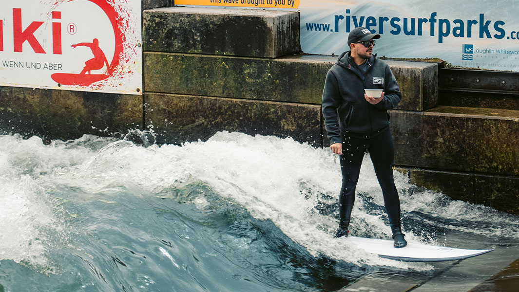 Maximilian Neuböck riding his surfboard