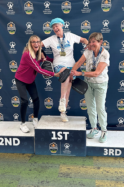 oldest-competitive-pickleball-player-joyce-jones-at-the-2025-national-senior-games-with-Phyllis-Reisgies-and-Sylvia-Mergl