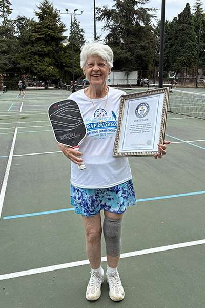oldest-competitive-pickleball-player-joyce-jones-with-guinness-world-records-certificate-and-pickleball-paddle