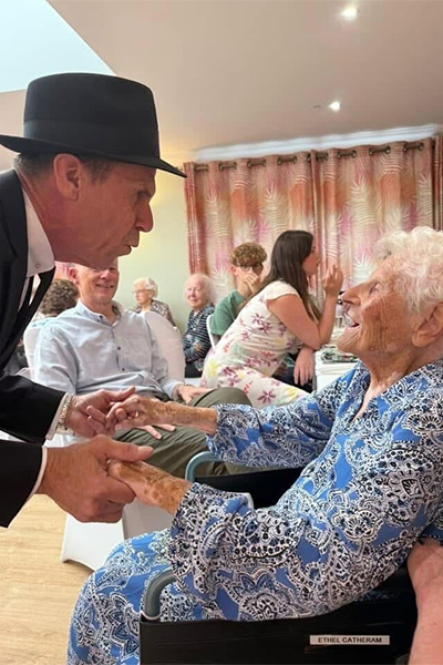 Ethel being serenaded by a Frank Sinatra impersonator