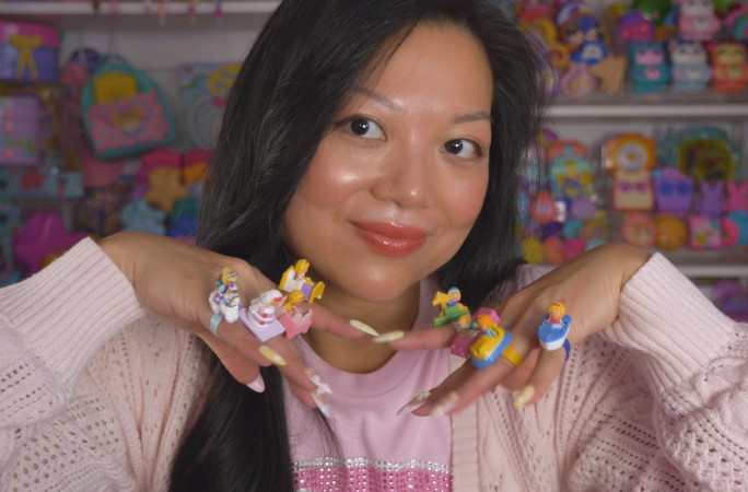 Kerchie showing off her Polly Pockets on her nails