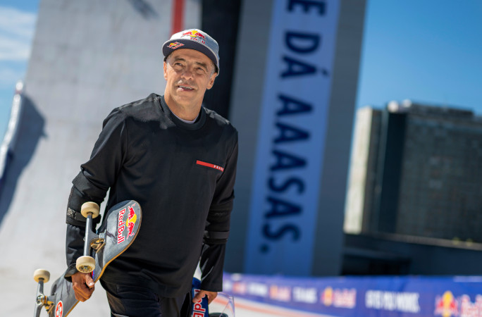 Sandro holding his skateboard