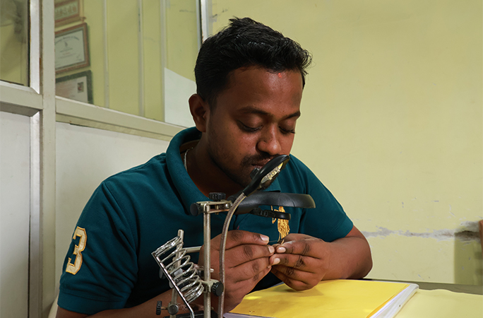 artist working on the spoon