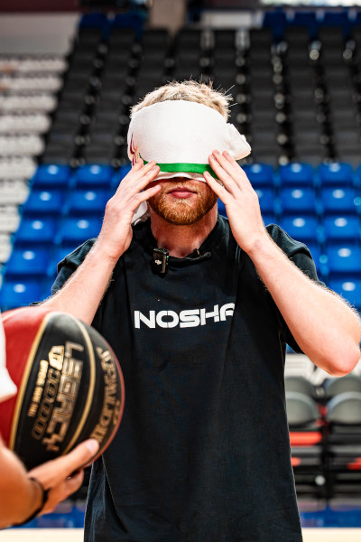 Tristan putting on a blindfold