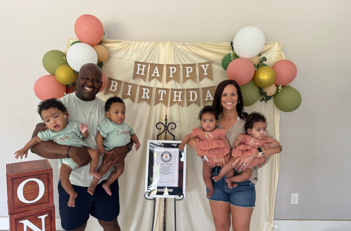 Bryant family with quadruplets and certificates