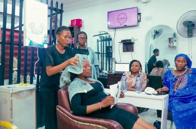 Mary drying a woman's hair