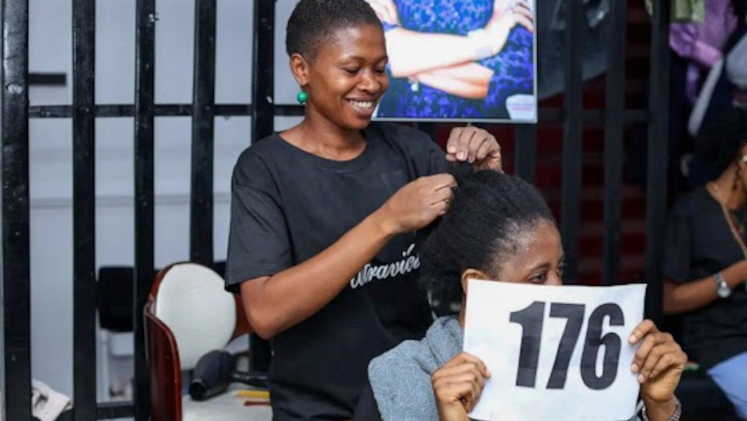 Mary braiding a client's hair