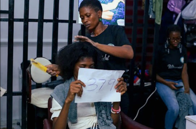 Combing the hair of her last client
