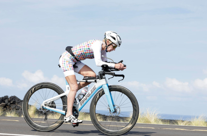 Natalie biking by the coast