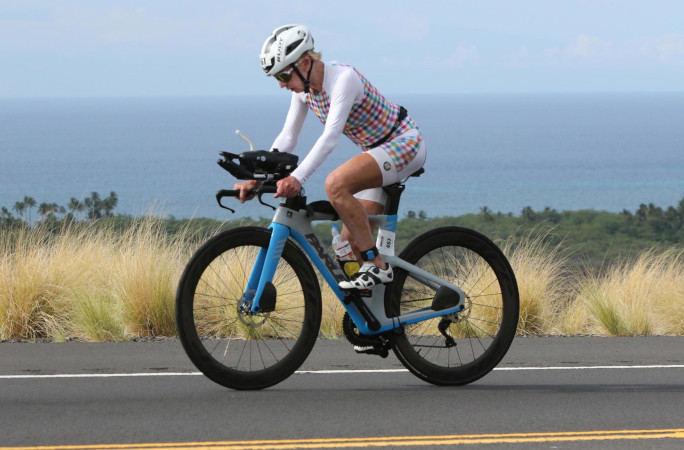 Natalie biking next to the water