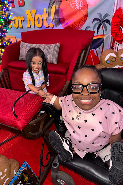 Jyoti and Wildine holding hands