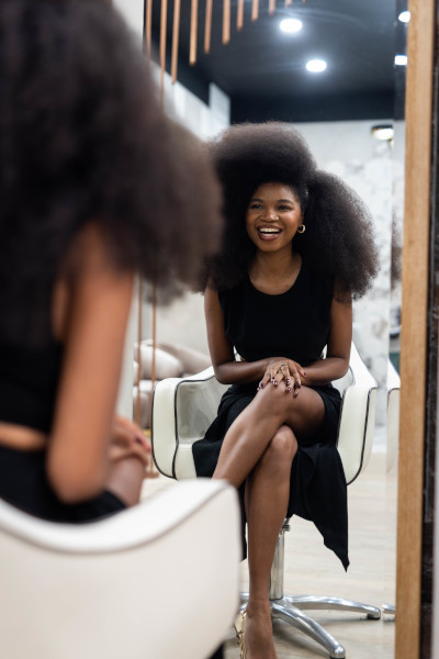 Jess looking at herself in the mirror and smiling