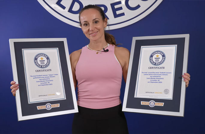 laura with two record certificates