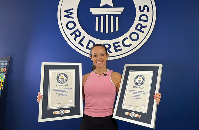 Laura holding record certificates