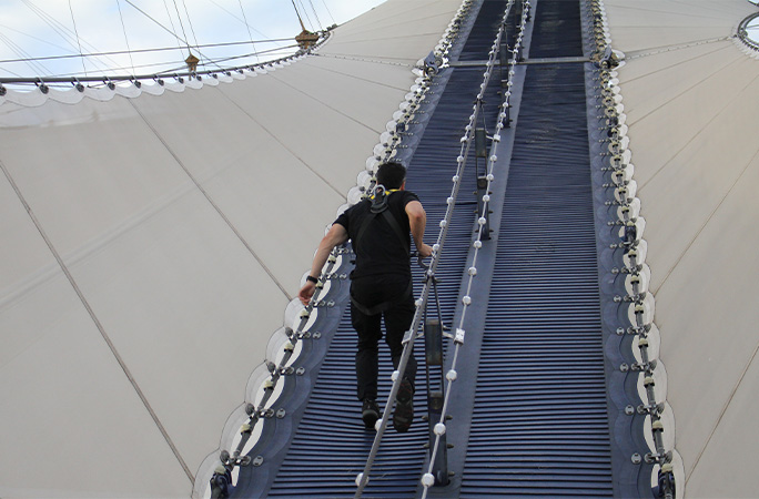 Josh climbing up The O2