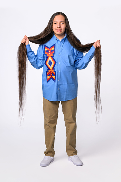 Reuben holding his hair in two bunches