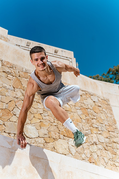 Ruben jumping and smiling