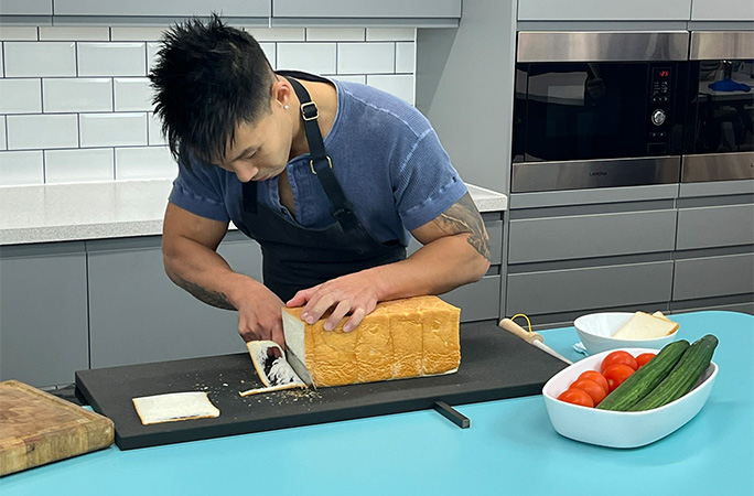 Wallace slicing the bread