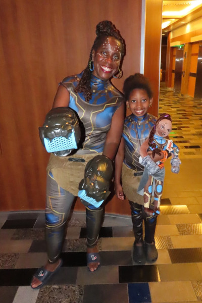 Tyesha and the little girl dressed as Shuri