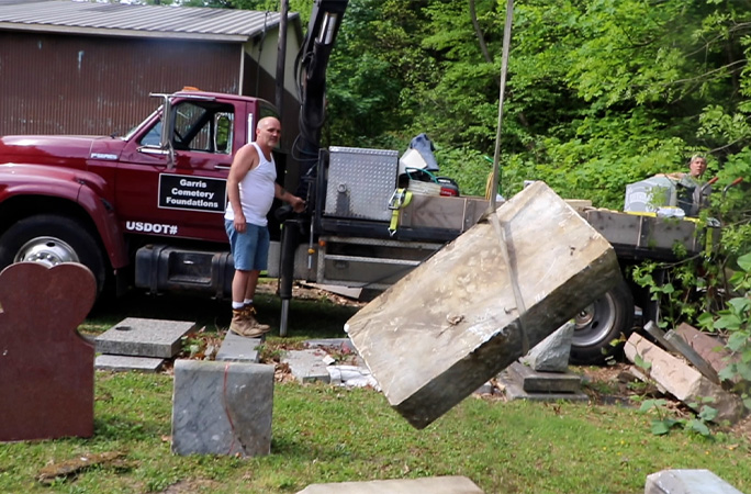 tombstone being lifted into place