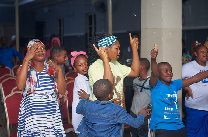 crowd supporting Confidence