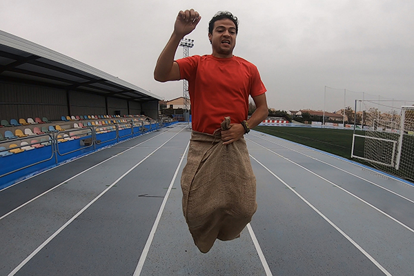 Christian jumping in a potato sack