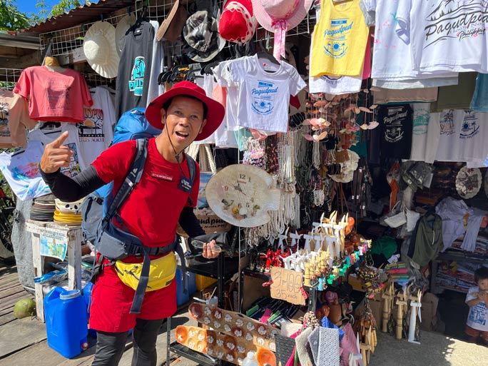 Lito in front of a shop
